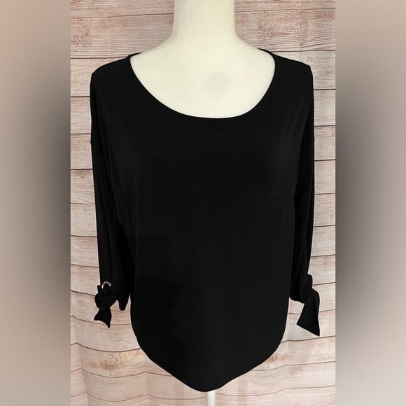 Chico's Tops - Chico’s blouse size 1 /8 black with tie sleeves.